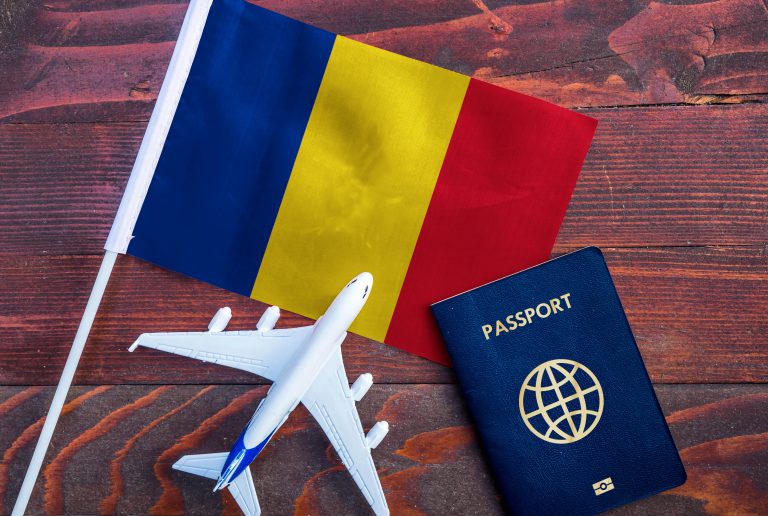 Flag,Of,Romania,With,Passport,And,Toy,Airplane,On,Wooden